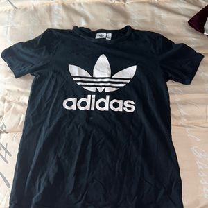 This is an adidas black and white shirt. It is not new but it’s not stained.